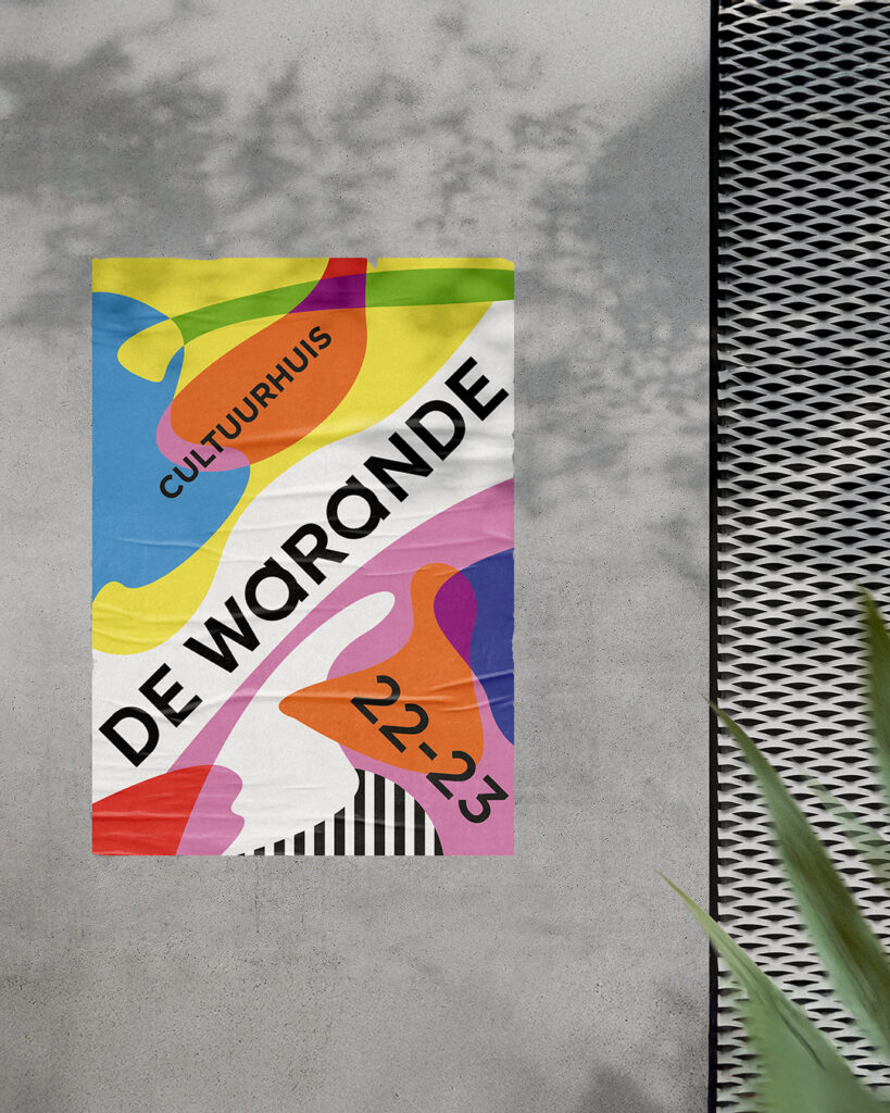 De Warande 2022-2023 season poster displayed on an outdoor wall