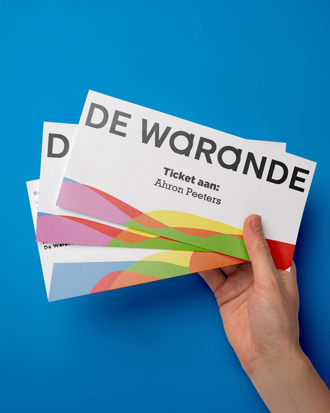 Custom envelopes for sending De Warande 2022-2023 season tickets, styled according to the campaign branding