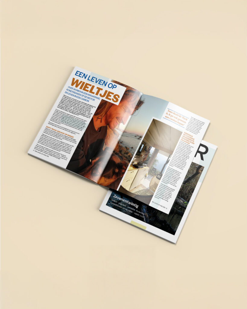 Open spread of Ember Magazine article with cover underneath